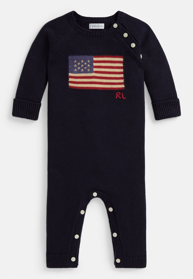 Ναυτικό ριπ φορμάκι με μακριά μανίκια, με κεντημένη αμερικανική σημαία στο στήθος και κουμπιά τύπου σναπ στον ώμο και στο κάτω μέρος.