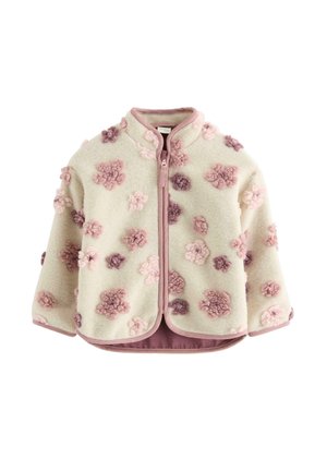 Veste en polaire couleur crème avec des motifs floraux texturés roses et violets, une fermeture éclair à l'avant et des bordures roses le long des bords et du col.