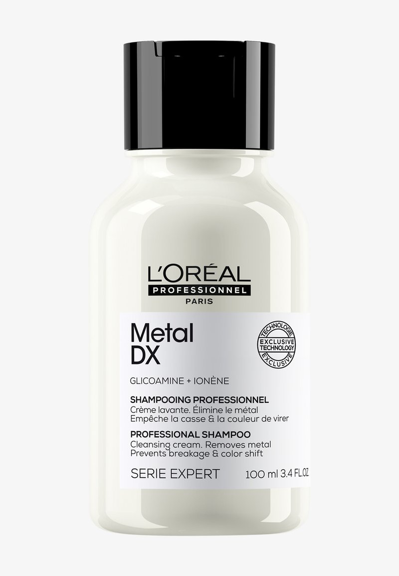 L'Oréal Professionnel Metal DX schampooflaska, 100 ml, med svart lock, vit etikett, tar bort metall, förhindrar brott och färgskift.