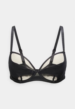 Μαύρο σουτιέν με μπανέλα, λεπτομέρειες με ανοίγματα, ρυθμιζόμενους ιμάντες και ημιδιάφανα πάνελ στα κυπέλλα και τις πλευρές.