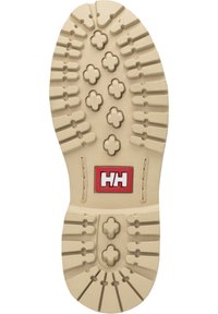 Rubber shoe sole in beige with patterned grooves and multiple circular grips; features a red rectangular logo with white text.