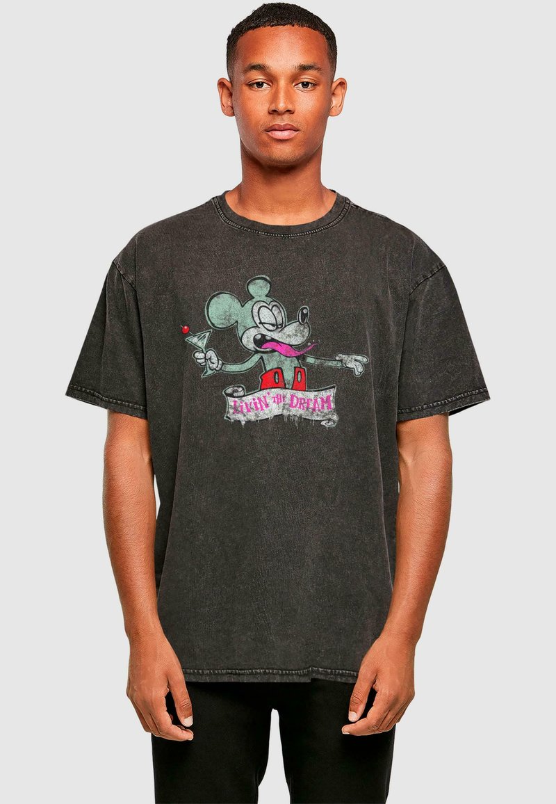 Sort oversized T-shirt lavet af bomuld med en falmet finish. Har et grafisk motiv af Mickey Mouse, der holder en cocktail, samt tekst under.