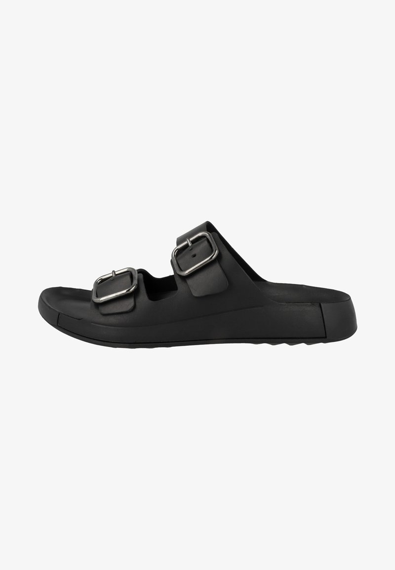 L'infradito nera in gomma presenta due fibbie regolabili in argento, design open-toe e una suola testurizzata per una buona aderenza. Forma elegante e minimalista.