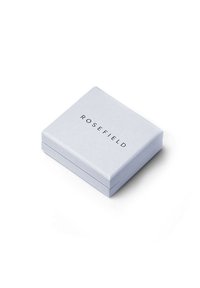 Rosefield packaging box, light blue with a matte finish, square shape, features the brand name “ROSEFIELD” printed in black, minimalistic design.