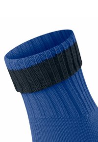 Calzino blu con texture a costine e un risvolto nero solido. Il design presenta un corpo liscio con una finitura durevole.