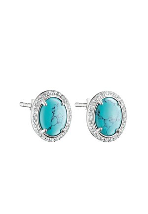 Orecchini a perno in argento con pietre turchesi ovali circondate da piccoli cristalli trasparenti su sfondo bianco.