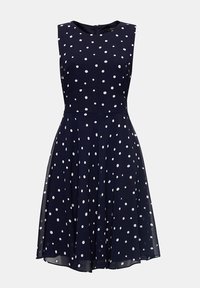 Mörkblå ärmlös klänning med vita prickar, figursydd överdel, utsvängd kjol och dragkedja bak. Slätt tyg med en lätt textur.