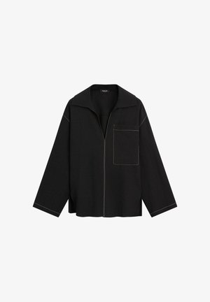 Black long-sleeve shirt with wide collar, front pocket on left side, and visible contrasting yellow stitching along seams and edges.