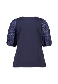 Marineblauw top met korte mouwen en opstaande, geborduurde mouwen met bloemenpatronen en kralen. Soepele stof en een relaxte pasvorm.