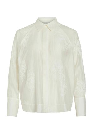 Chemise boutonnière ivoire clair avec motifs floraux brodés, manches longues et col classique. Texture lisse et coupe décontractée.