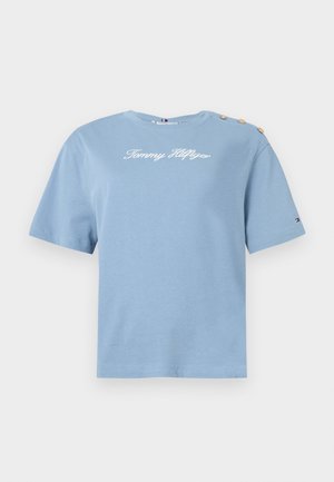 Light blue short-sleeve t-shirt made of cotton. Features embroidered "Tommy Hilfiger" logo and decorative buttons on the shoulder.