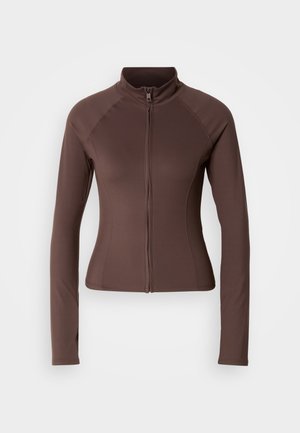 Giacca marrone con zip e maniche lunghe, realizzata in tessuto elastico, presenta un alto colletto e una forma aderente con design delle spalle senza cuciture.