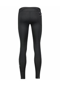 Leggings de sport noirs à coupe ajustée, dotés d'une texture lisse, d'accents réfléchissants et de zippers à la cheville pour un ajustement.