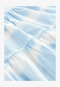 Atlasīts, blue tie dye