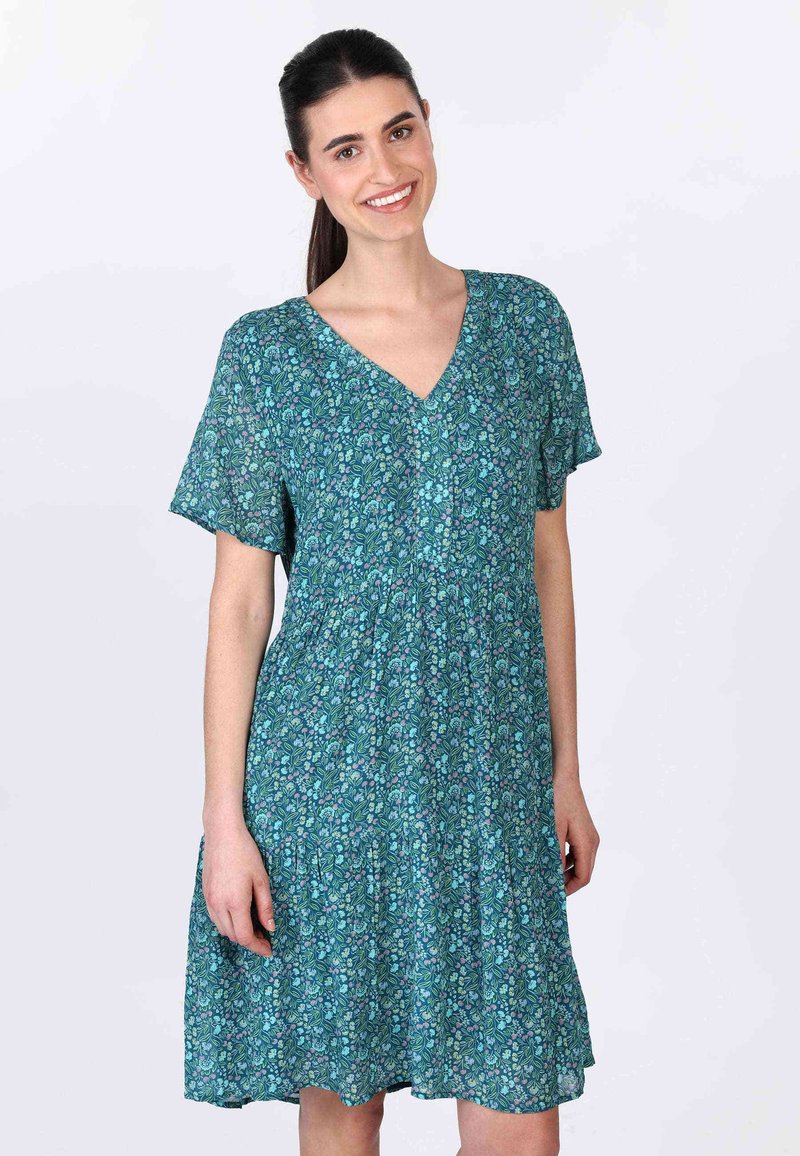 V-Ausschnitt, kurzärmeliges Kleid aus leichtem Stoff mit teal-farbener Basis und floralem Muster in Lila und Grün. Schwingendes Rockdesign.