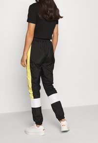 Ellesse Tracksuit bottoms - black