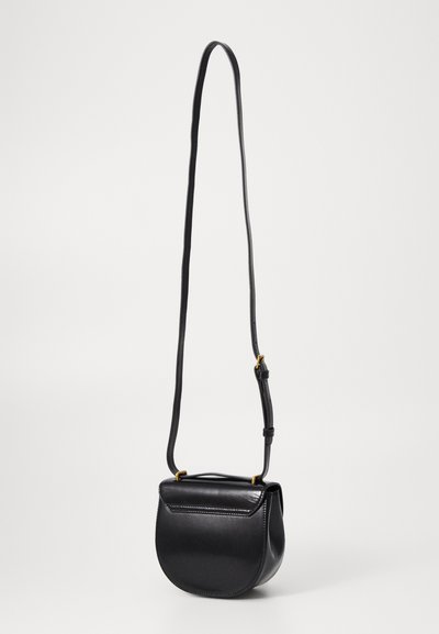 Black leather crossbody bag with a curved shape, smooth texture, and a gold hardware accent. Features an adjustable strap and flap closure.