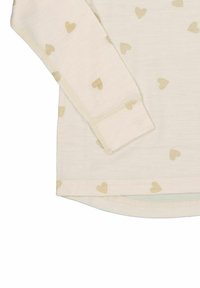 Vaalean kerma pitkähihaisessa paidassa on toistuva pieniä kultaisia sydämiä. Pehmeää kangasta, pyöristetty helma ja ribbireunat.