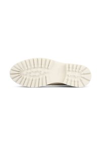 Semelle extérieure en caoutchouc blanc avec des motifs de profondeur et des détails texturés, comportant des étoiles surélevées pour une meilleure adhérence et durabilité.