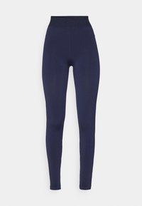 Leggings blu navy con vita alta e un elastico texturizzato. Design aderente con tessuto liscio e senza cuciture visibili.