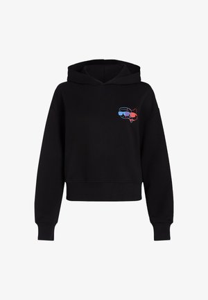 Sudadera corta negra con un gráfico frontal de un gato con gafas, con acentos en azul y rojo. Fabricada con una tela suave y de corte relajado.