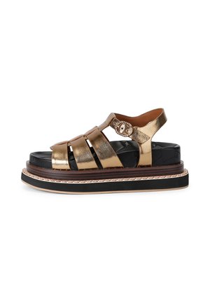 Gold metallic leather platform sandal with black quilted footbed, multiple straps, buckle closure, and thick layered sole.