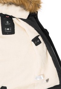 Black outdoor jacket with a soft cream fleece lining, fur-lined hood, and an inner pocket featuring a headphone port.