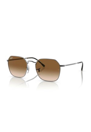 Occhiali da sole esagonali di colore marrone con una leggera montatura in metallo. Presentano sottili aste nere e un logo discreto sulla lente sinistra.