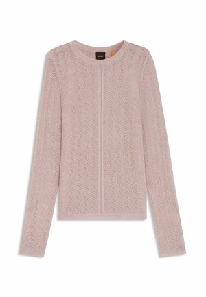 Maglione testurizzato rosa chiaro con un motivo a zigzag, scollo rotondo e maniche lunghe. Presenta una cucitura centrale e dettagli a coste all'orlo.