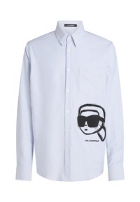 Button-up shirt in light blue and white stripes, featuring a black graphic of a face with sunglasses on the left chest pocket.