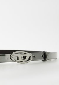 Gray faux leather belt with a shiny silver oval buckle. Smooth texture with adjustable holes along the strap. Simple design.