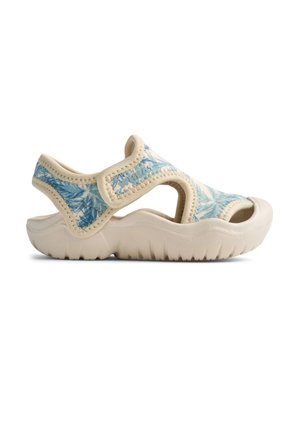 Lichtgewicht sandalen met een blauw palmbladpatroon op een zacht, beige materiaal. Open ontwerp en een textuurlijke zool voor grip.