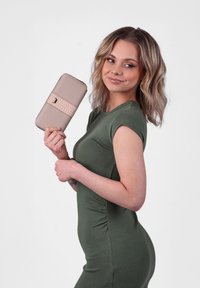 Beige wallet with a textured pink band, featuring an embossed logo. The wallet has a rectangular shape and smooth material.