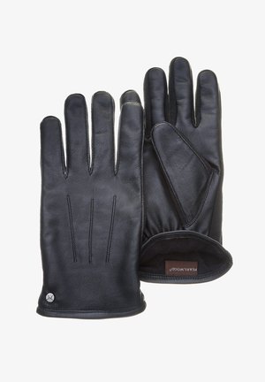 Gants en cuir noir avec trois lignes de couture au dos. Texture lisse, poignet ajusté et doublure douce visible à l'intérieur. Étiquette de la marque affichée.