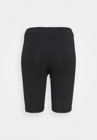 Svarta stretchshorts med en slät textur, med en figurnära design och längd till mitten av låret. Inga synliga logotyper eller mönster.