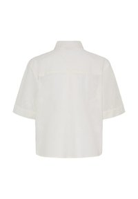 Vue arrière d'une chemise blanche à manches courtes, coupe ample, ourlet droit et col classique.