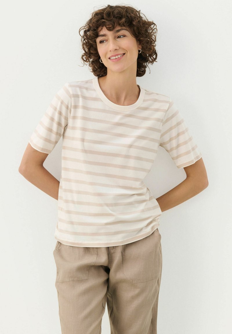 Lightweight, short-sleeve t-shirt in cream with varying beige horizontal stripes. Rounded neckline, soft texture, and relaxed fit.