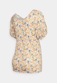 Blusa com padrão floral em creme, apresentando mangas curtas bufantes, um decote em V largo e uma cintura elástica para um ajuste confortável.