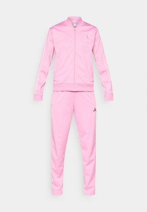 Pink tracksuit made from smooth synthetic fabric, featuring a zip-up jacket and matching pants. Includes subtle logo accents on both pieces.