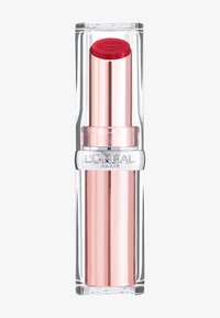 Red lipstick in a clear tube with metallic silver accents and a pink base. Cap features a red top with an embossed logo.