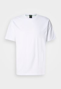 T-shirt en coton blanc avec un col rond et des manches courtes. Présente un logo subtil imprimé à l'avant dans une couleur claire. Coupe classique.