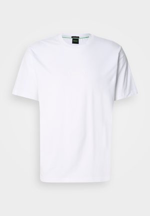 T-shirt en coton blanc avec un col rond et des manches courtes. Présente un logo subtil imprimé à l'avant dans une couleur claire. Coupe classique.