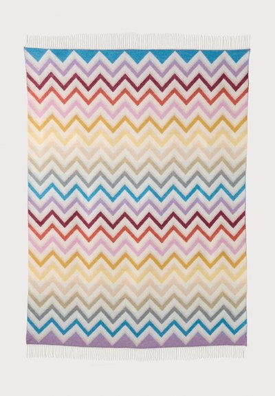 Woven blanket featuring a chevron pattern in multiple colors: burgundy, pink, yellow, grey, blue, and purple with fringed edges.