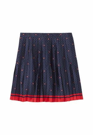 Jupe plissée bleu marine avec petits motifs floraux blancs et rouges et un ourlet uni rouge avec deux fines rayures bleu marine.