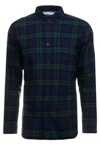 Camicia a maniche lunghe a scacchi in verde scuro e blu navy, con colletto a bottoni, taschino frontale e bottoni marroni. Tessuto in flanella morbida.