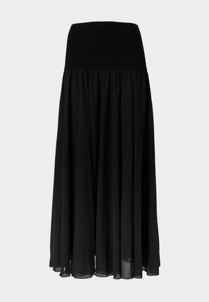 Jupe maxi noire en tissu léger, dotée d'une large ceinture élastique et d'un design fluide plissé avec un aspect transparent à l'ourlet.