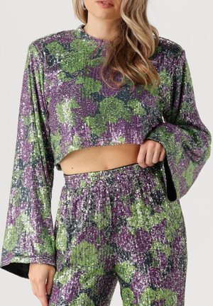 Cropped sequined top and matching pants in purple and green floral pattern, featuring long sleeves and a ribbed texture.