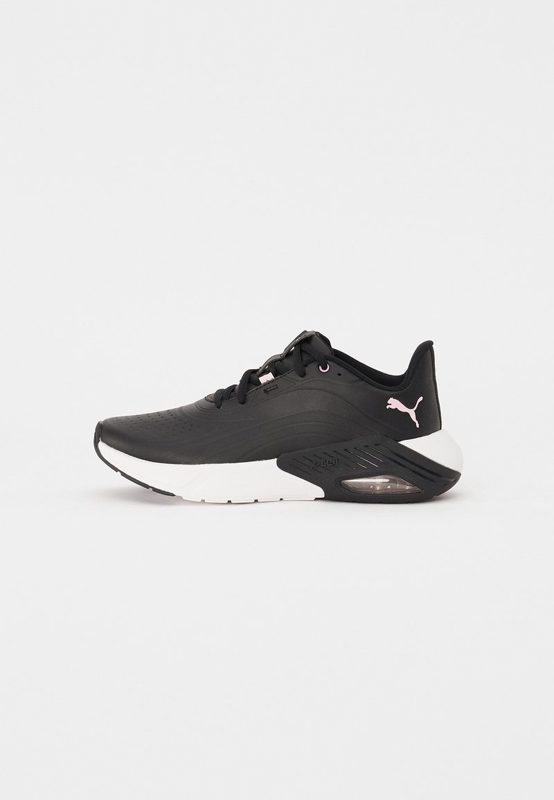 Black athletic shoe with a textured upper, white midsole, and transparent cushioning. Features a subtle logo on the heel and laces.