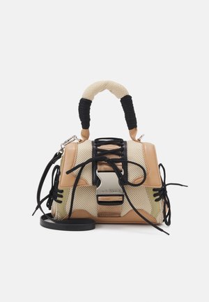 Tan and beige handbag with mesh panels, black accents, a textured handle, lace detail, and a silver clasp. Includes a black shoulder strap.