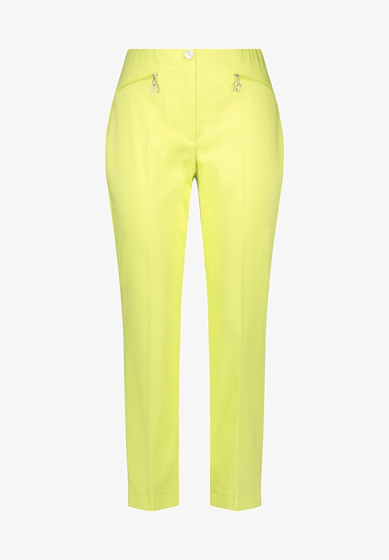Pantalon slim vert clair avec poches zippées sur les hanches, taille élastique avec bouton, pli creux à l’avant, longueur cheville.